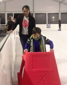 kid learning to skate at Oly on Ice, ice rink in Olympia