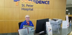 Scott Hibberd, a volunteer at Providence St. Peter Hospital's Information Desk