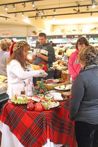 People at tables with samples at Bayview Thriftway