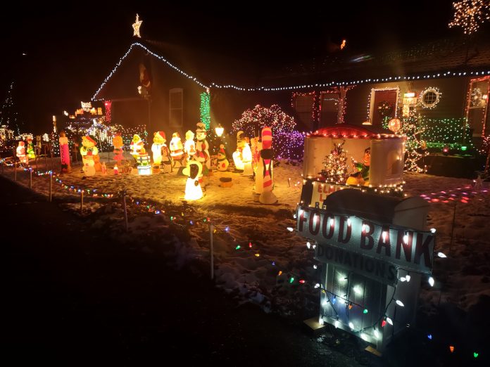 a home covered in Christmas lights in Olympia