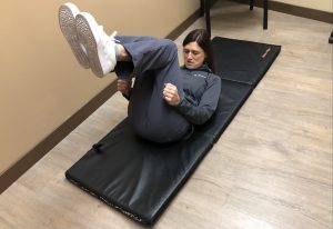 Dr. Jennifer Penrose at Penrose Physical Therapy in Lacey shows how to tuck your head to your chest and roll if you fall,