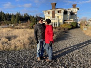 couple standing outside The Port Ludlow Resort