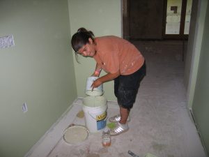  Rodocker painting a wall in the GRuB farmhouse 