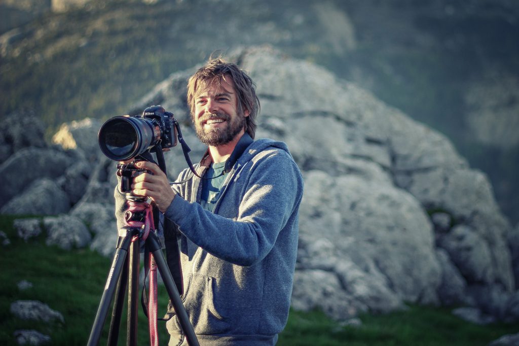 Andy Mann taking photos in the Alps with Nat Geo LIve