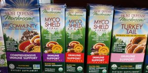 rows of mushroom supplements in boxes on a shelf at NW Remedies
