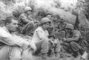 22-year old Harvey Drahos (front and center in tee-shirt) flanked by his fellow infantrymen on Okinawa.