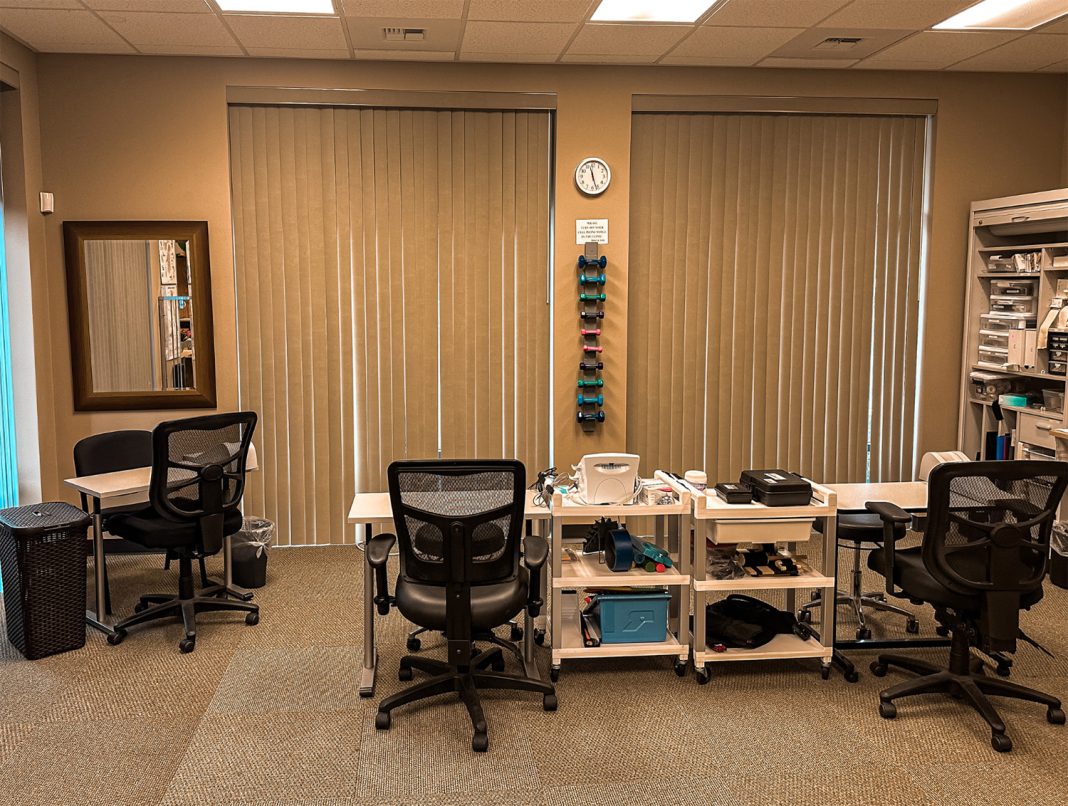 Inspire Physical & Hand Therapy Lacey office with chairs and therapy equipment on shelves