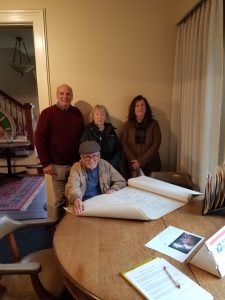 Jack McBride, center, with the 1960 architectural drawings he donated to the Schmidt House. Family members behind him from left to right: son-in-law Bob Embrey, Jack’s wife Helen McBride and daughter Kay McBride.