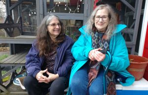 Liz and Jane sitting on a porch