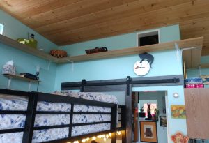 interior of a tiny home with cat walkways by the ceiling