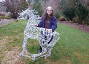 Lix with a wire horse sculpture she created