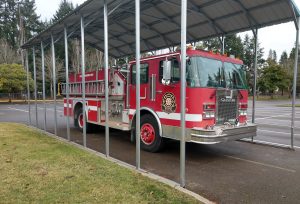 New Market Skills Center in Tumwater fire truck under a large car port