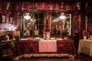 lavishly decorated table with a chocolate fountain in the middle