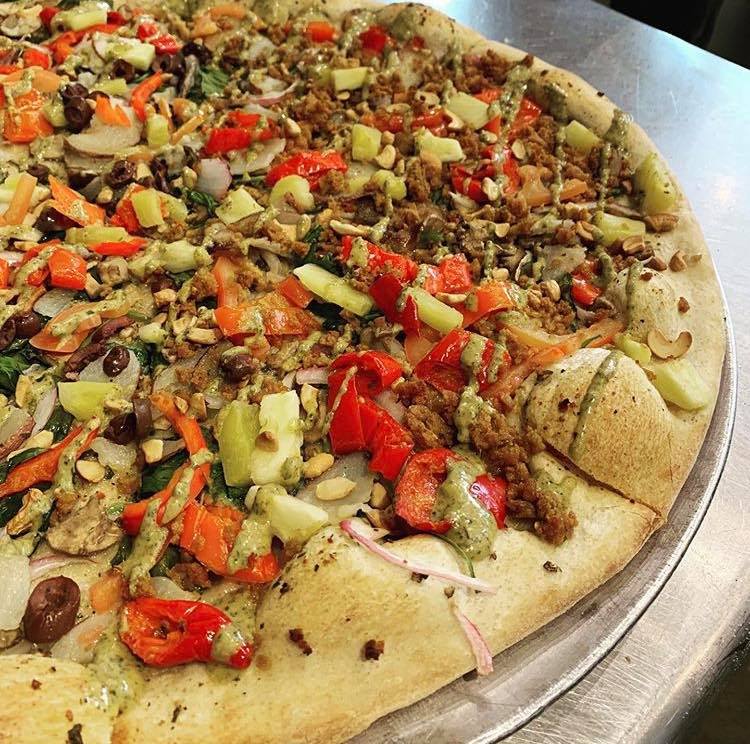 large pizza with vegan sausage