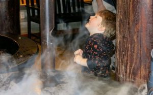 kid playing in smoke