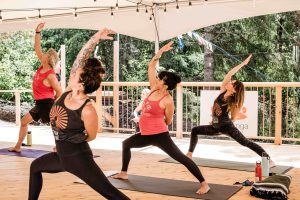women doing yoga outside