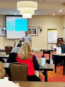 People sitting at desks at a Duncan Integrative Medicine boot camp