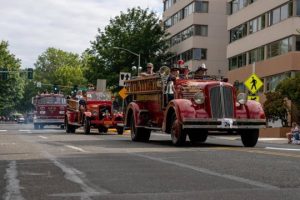 three of Firehouse 5's fire trucks in the 2022 Capital Lakefair Parade