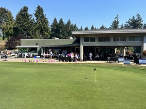 Olympia Country and Golf Club clubhouse with pinwheels lining the lawn