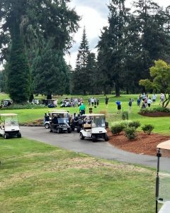 golf carts and people at the Olympia Country and Golf Club