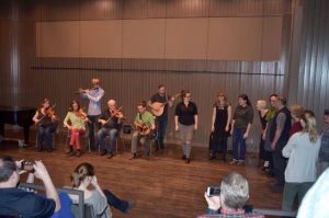 people sitting and dancing at the Sean-nós Northwest Traditional Irish Weekend