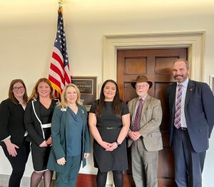 Sensory Tool House CEO Katie McMurray and SBDC Director Jennifer Dye with staff of U.S. Rep. Marilyn Strickland. 