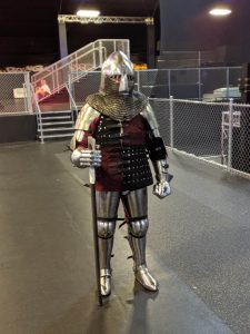 Pat Carns in his steel armor with a sword