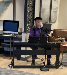 John sitting at a piano at Senior Services for South Sound