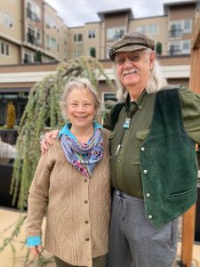 John and Maia O’Brien standing outside of Harbor Heights apartments in Olympia