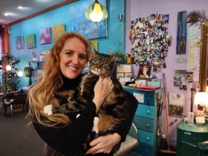 Olympia shop cat Otto being held by Jamie Lee at Jamie Lee & Company hair salon