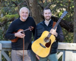 fiddler Randal Bays and guitarist Clint Dye photo with their instruments