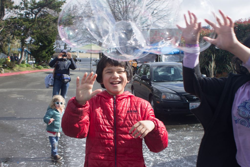 kids playing with bubbles