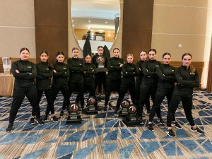 Capital HIgh School dance team group photo all in black at Nationals