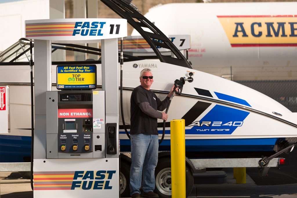 A man refueling his boat at Fast Fuel in Olympia