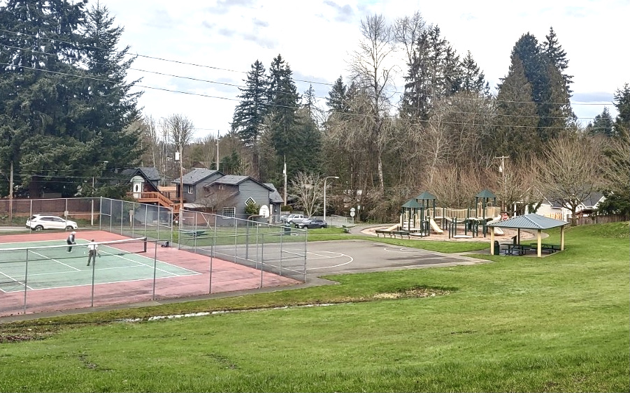 Jim Brown Park on Tumwater Hill with a tennis court, a playground and a basketball half-court.