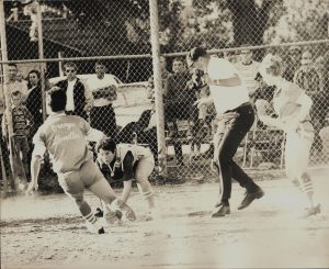 Maggie Bean playing softball, black and white photo