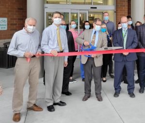 Dr. Peterson cutting the ribbon at the Spine Center for OlyOrtho