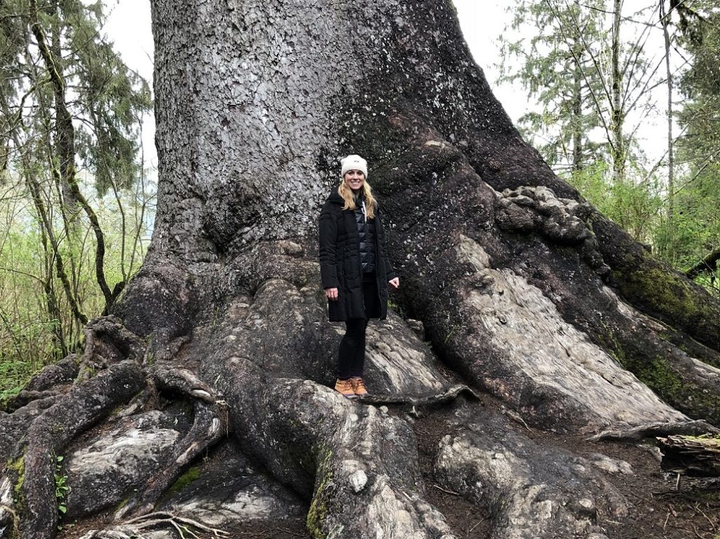 Christine Hammer standing in front of a huge tree