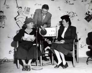 Margaret McKenny, left, is shown during a radio broadcast, black and white photo