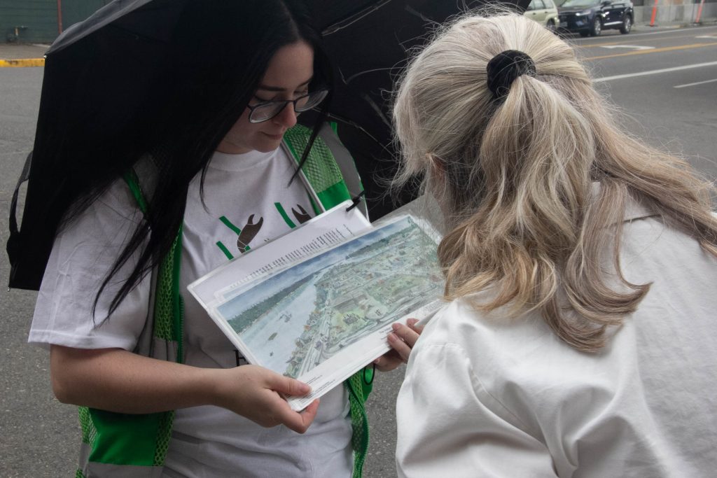 two little girls looking at a map during a Puget Sound Estuarium walking tour.