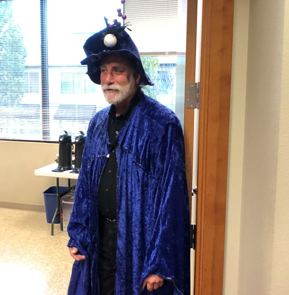 Bob wearing a blue wizard robe and a funny hat