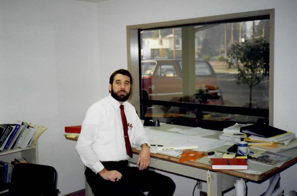 Bob Connolly at a desk when he was younger