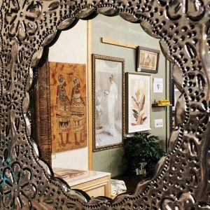 antique mirror with elaborate metal frame at South Sound Furniture in Olympia