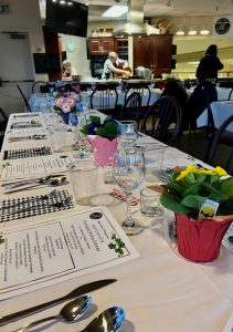 elegant dining table set up with menus, linen and silverware