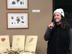 Lalita Calabria, faculty member at The Evergreen State College, speaking in front of her artwork