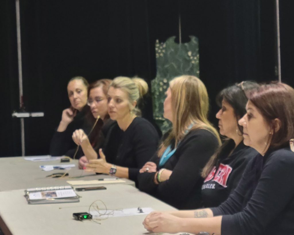 panel of local speakers sitting at a table at the e Yelm Community Resource Fai