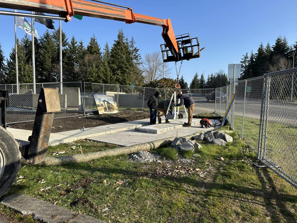 workers pouring concrete for the foundation of the Gold Star Memorial in Lacey