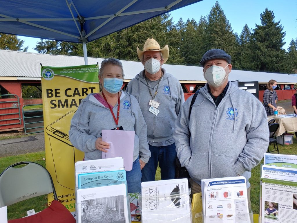 WSU Master Recycler / Composter Program volunteers at a booth outside at an event