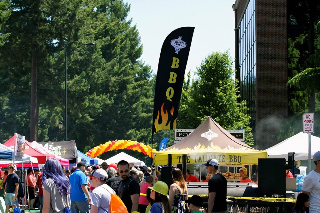 large crowd milling around the pop up tents at the South Sound BBQ Festival