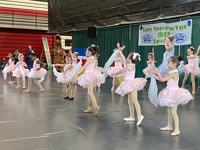 young ballerinas in pink tutus dancing